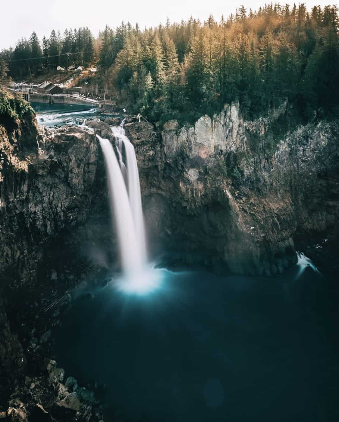 Snoqualmie Falls cascading into a forest pool in Washington