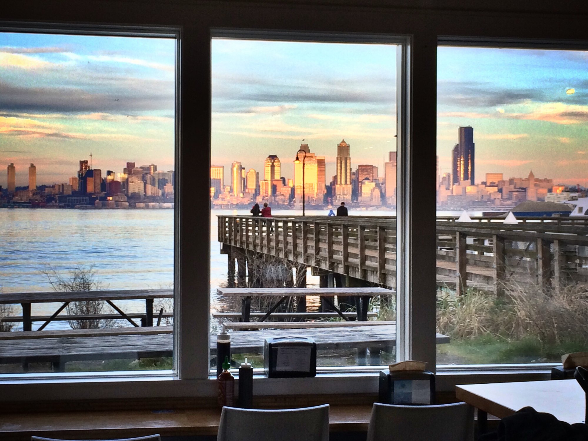 Fine dining table overlooking Seattle at sunset